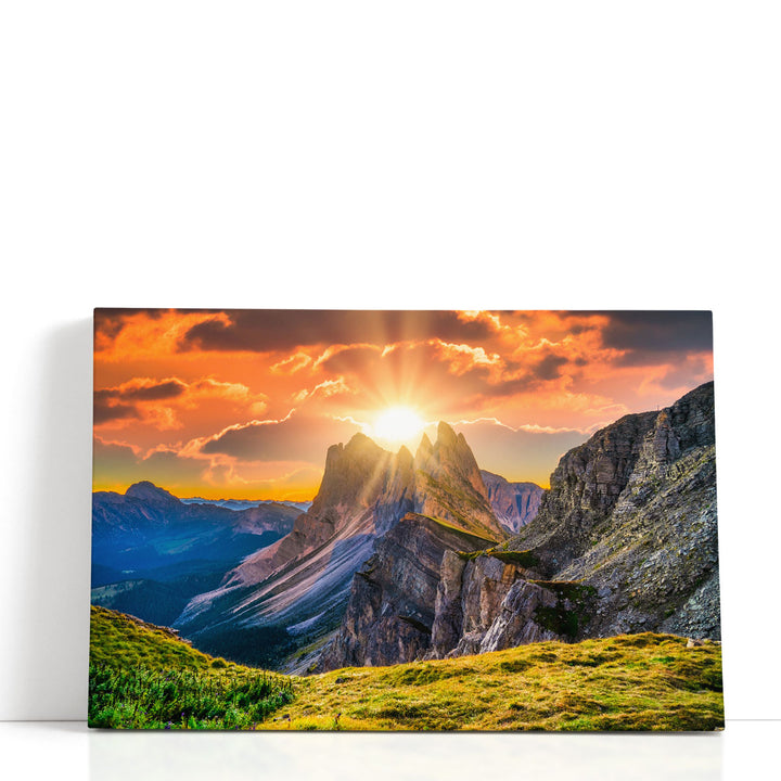 Orange sunrise wall art with mountain peaks