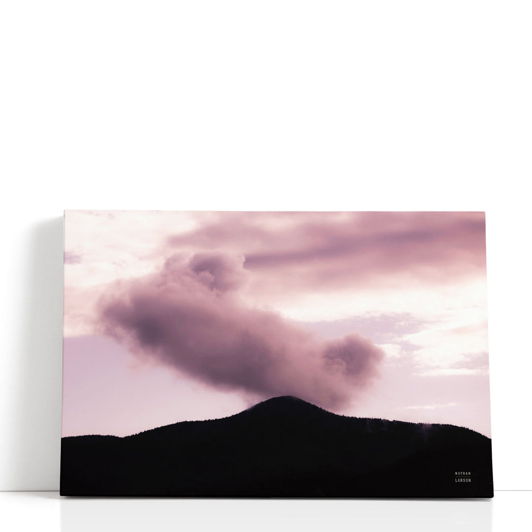Mountain wall decor with cloud-filled sky