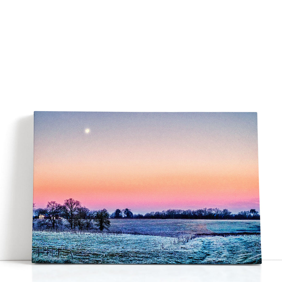Moon canvas over ocean with orange glow
