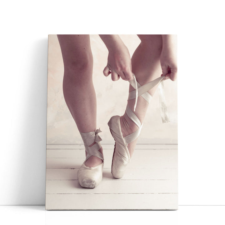 Close-up Of A Ballerina Putting On Ballet Slippers - Canvas Print Wall Art