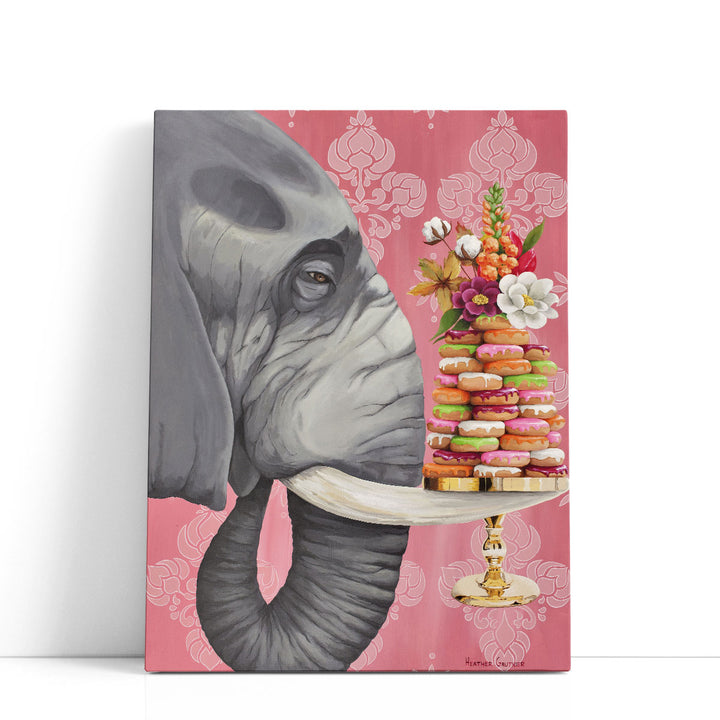 Elephant balancing donuts on tray
