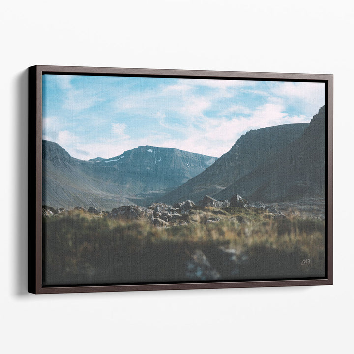 Neutral rock prints with textured stone and mountain view