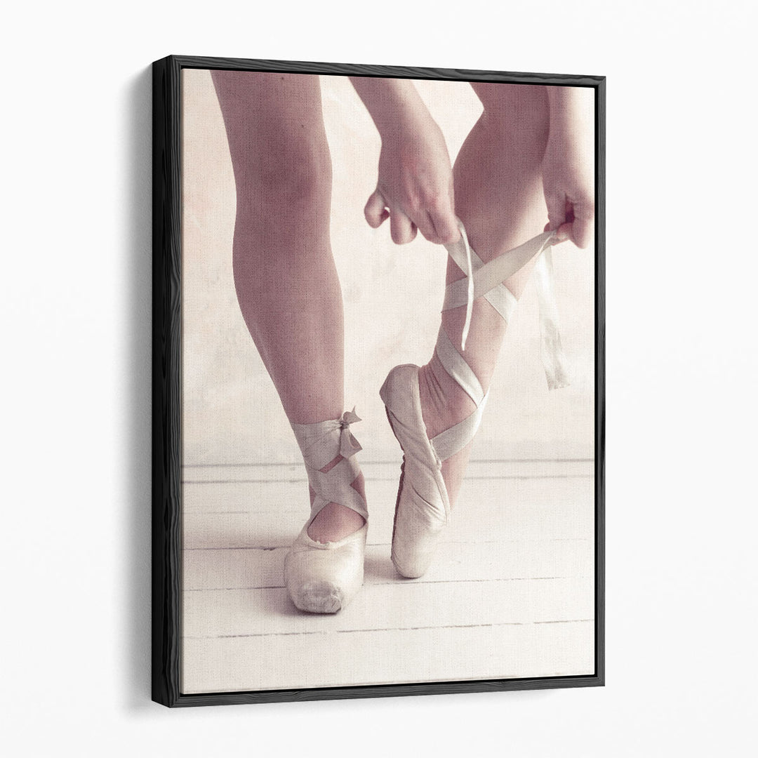 Close-up Of A Ballerina Putting On Ballet Slippers - Canvas Print Wall Art