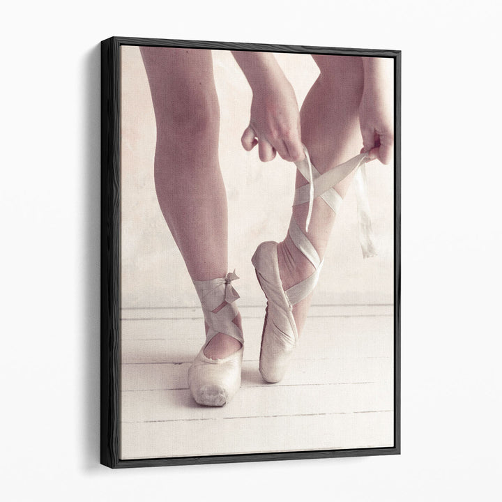 Close-up Of A Ballerina Putting On Ballet Slippers - Canvas Print Wall Art