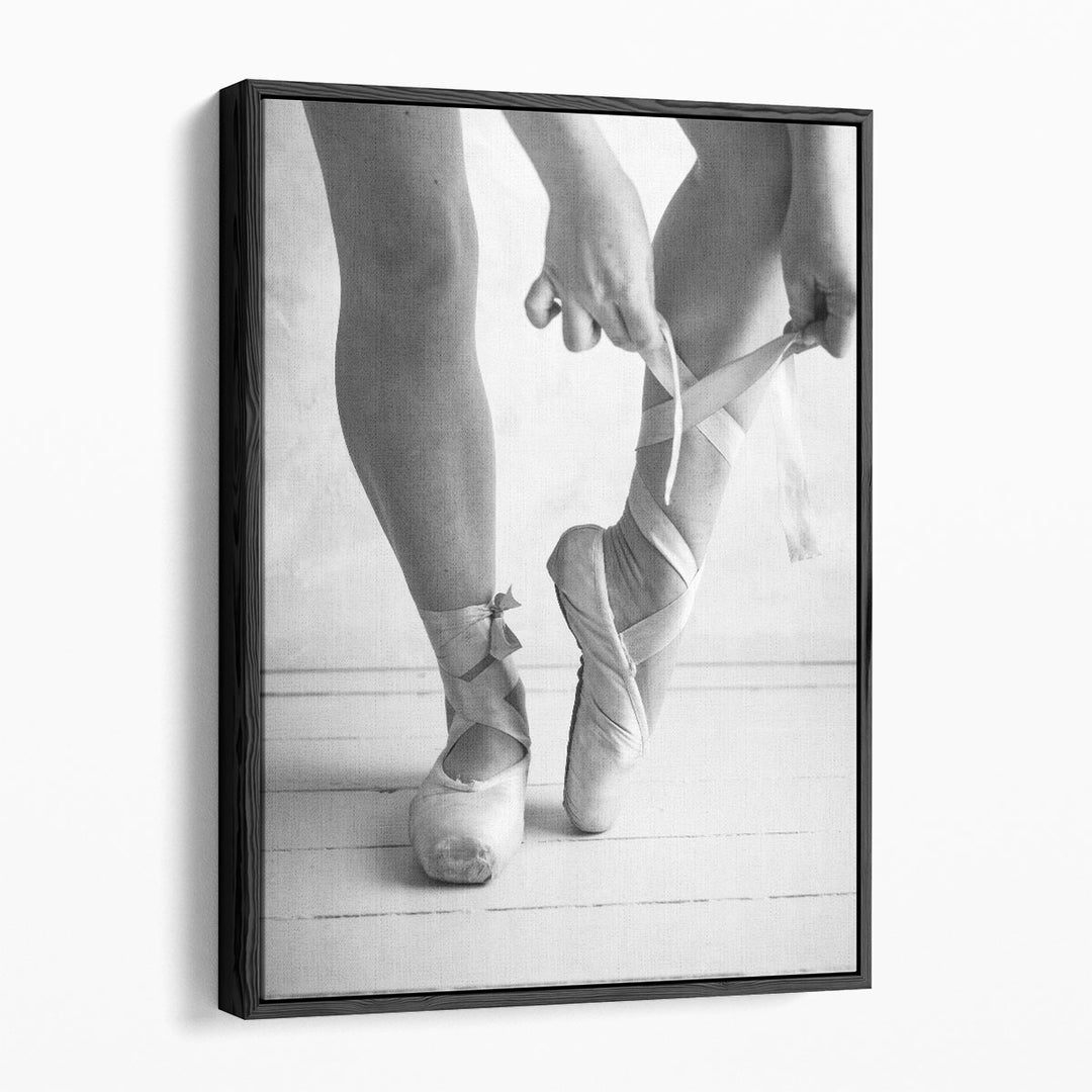 Close-up Of A Ballerina Putting On Ballet Slippers Black And White - Canvas Print Wall Art