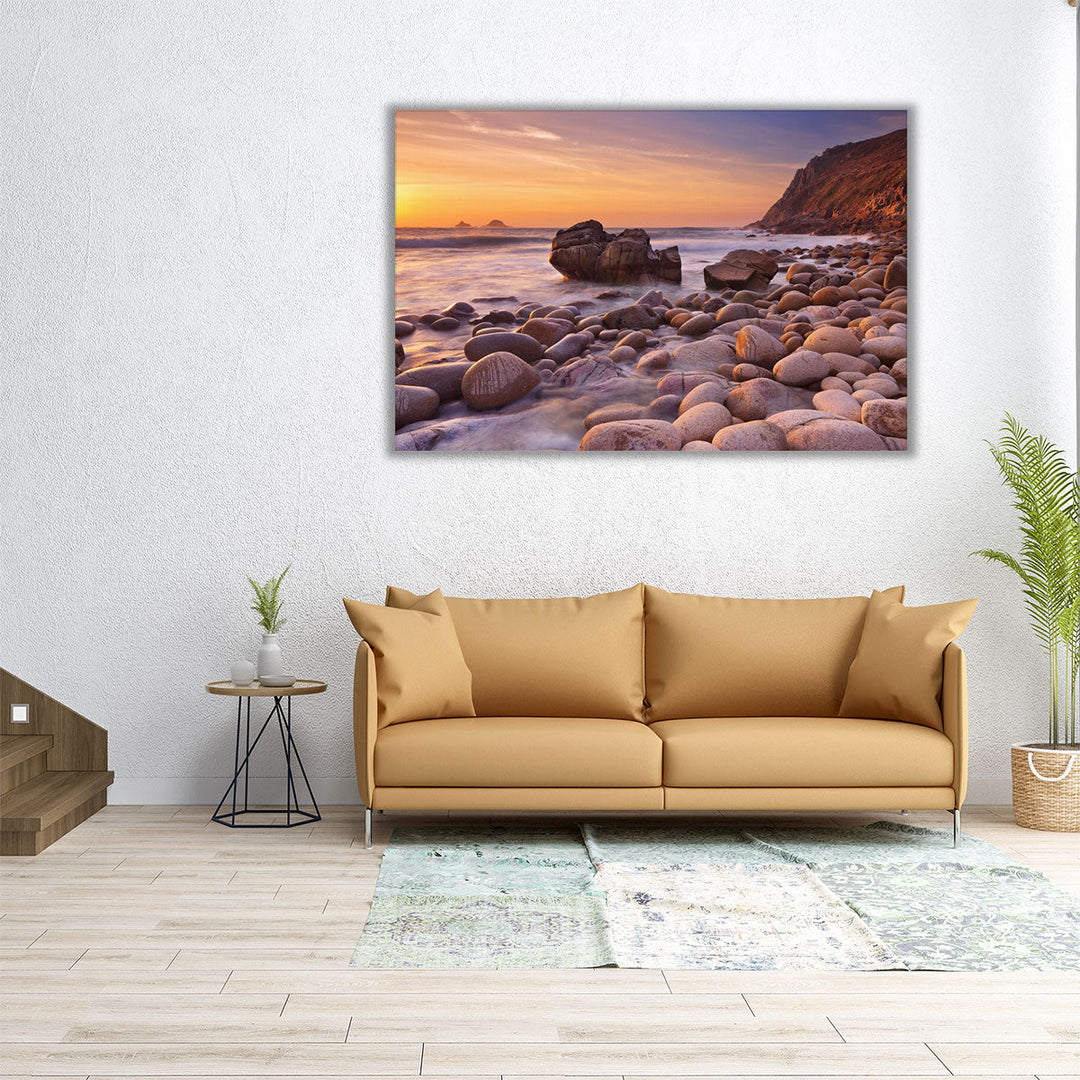 The Rocky Beach Of Porth Nanven, England During Sunset - Canvas Print Wall Art