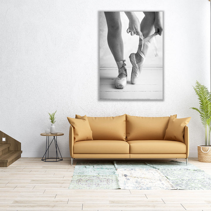 Close-up Of A Ballerina Putting On Ballet Slippers Black And White - Canvas Print Wall Art