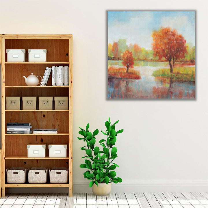 Blue neutral and orange wall art with peaceful lake view