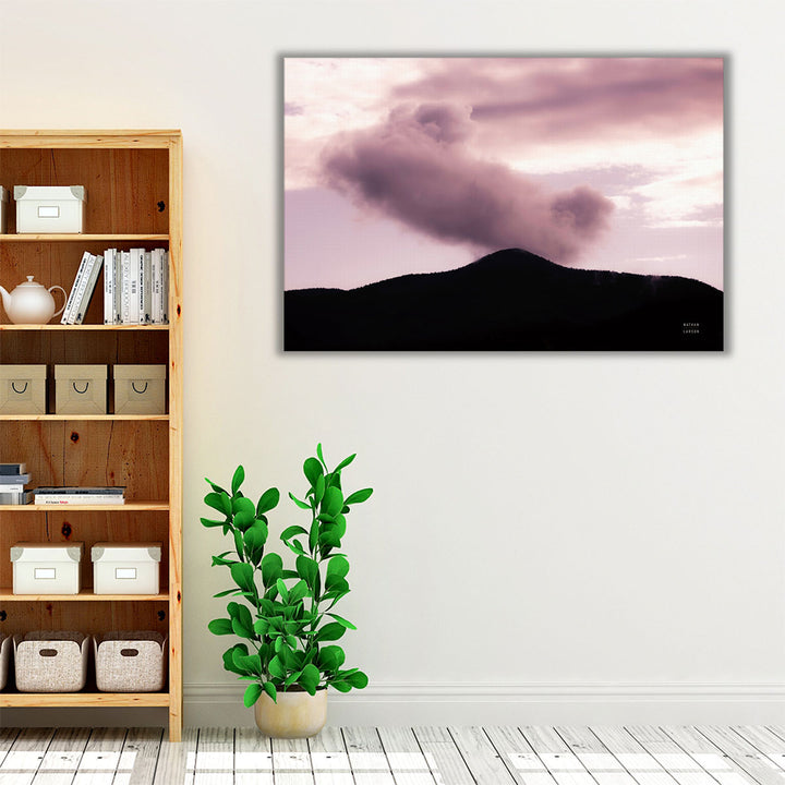 Tranquil living room wall art with mountain silhouette and clouds
