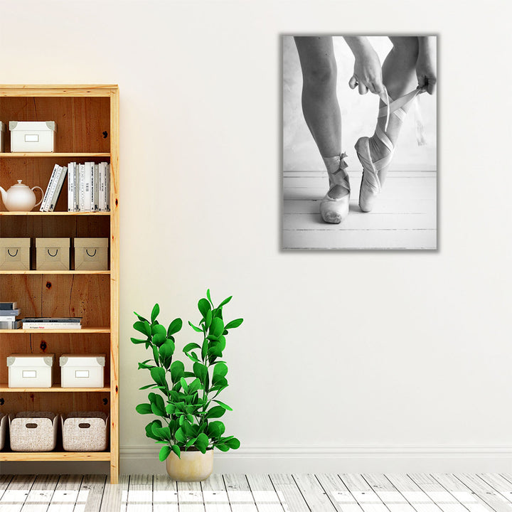 Close-up Of A Ballerina Putting On Ballet Slippers Black And White - Canvas Print Wall Art