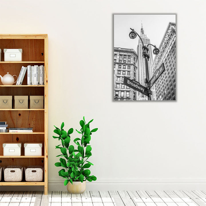 Street Lamp And Signs With Empire State Building, New York 2 Black And White - Canvas Print Wall Art