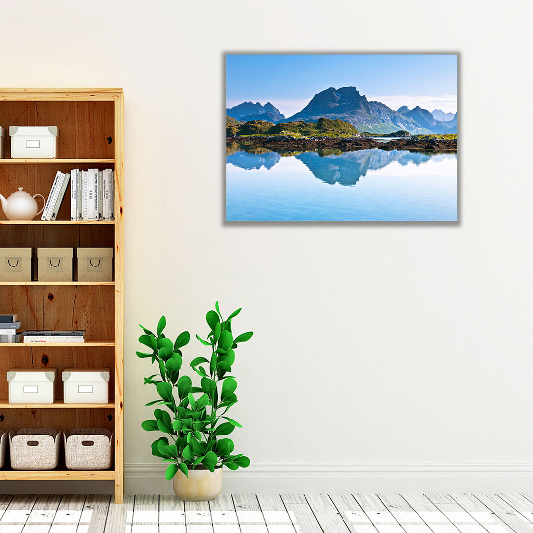 Blue-toned wall art with mountain and water view