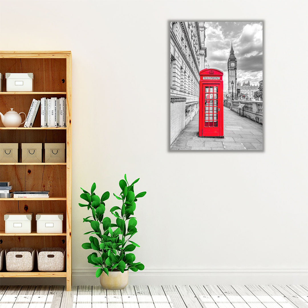 Black framed canvas hanging above sofa