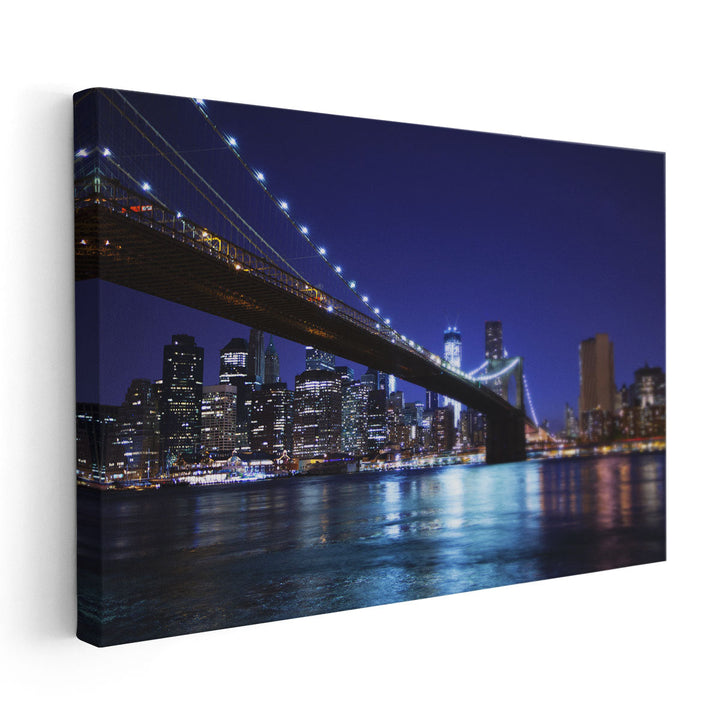 Manhattan and The Brooklyn Bridge At Night - Canvas Print Wall Art