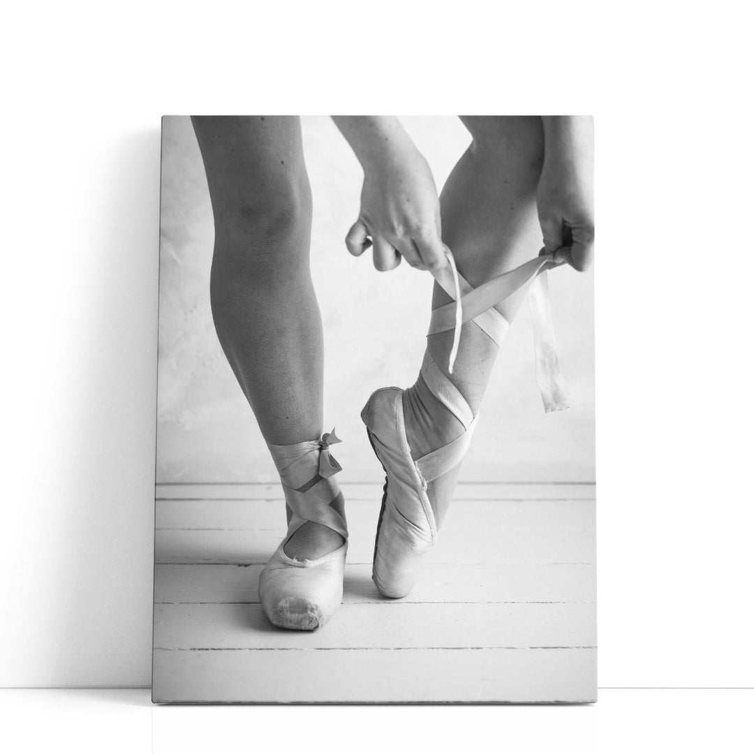 Close-up Of A Ballerina Putting On Ballet Slippers Black And White - Canvas Print Wall Art