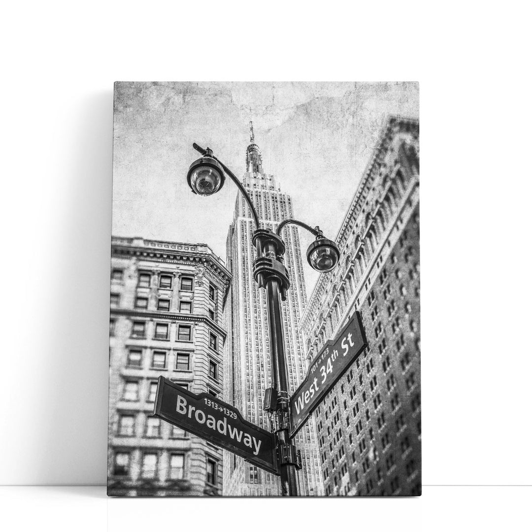 Street Lamp And Signs With Empire State Building, New York 1 Black And White - Canvas Print Wall Art