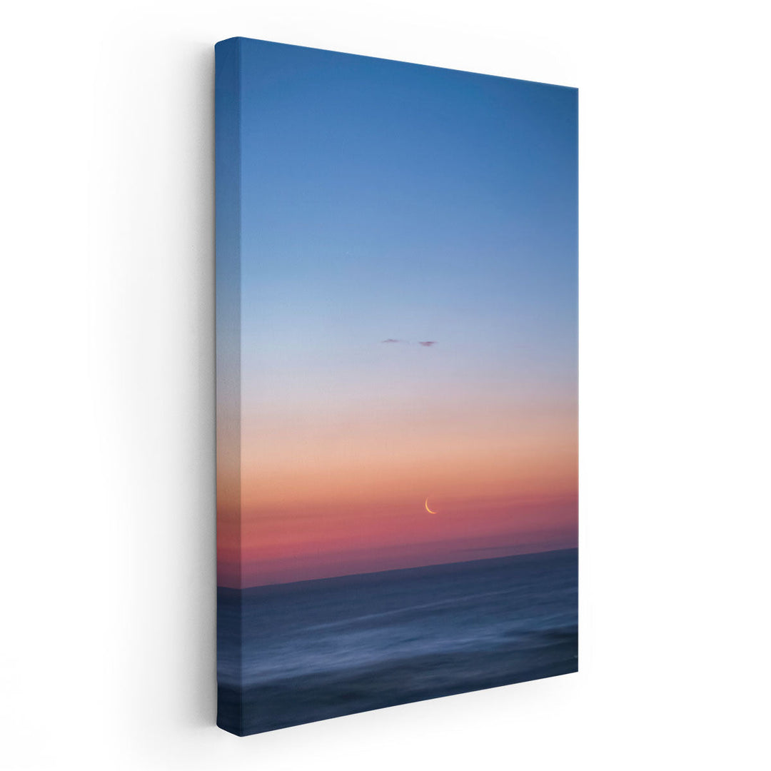 Fingernail Moon Setting Over Ocean During Sunset - Canvas Print Wall Art