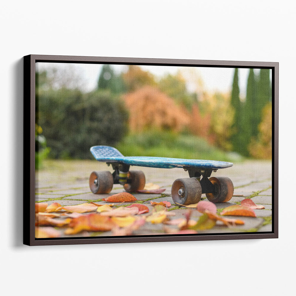 Close Up of a Skateboard With Colorful Autumn Leaves - Canvas Print Wall Art