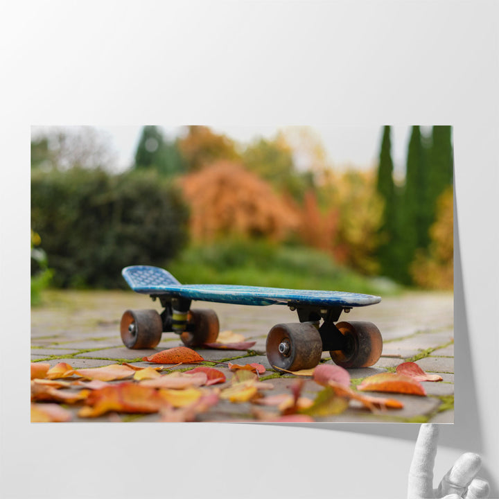 Close Up of a Skateboard With Colorful Autumn Leaves - Canvas Print Wall Art