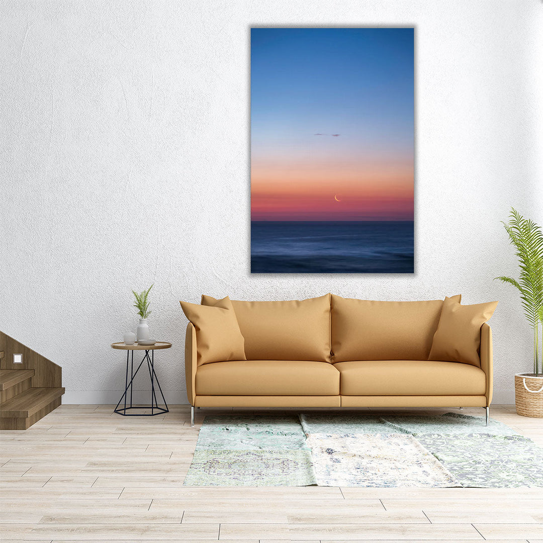 Fingernail Moon Setting Over Ocean During Sunset - Canvas Print Wall Art