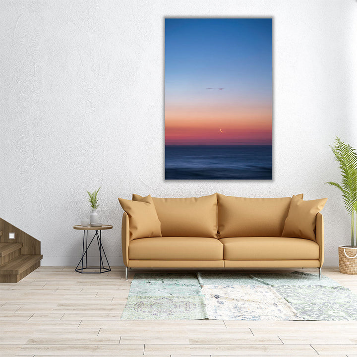 Fingernail Moon Setting Over Ocean During Sunset - Canvas Print Wall Art