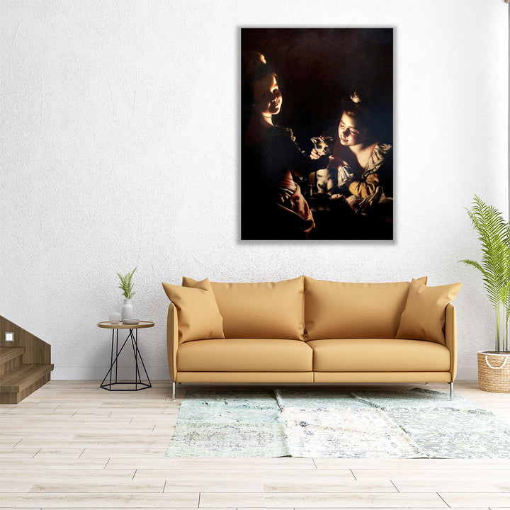 Two Girls Dressing a Kitten by Candlelight - Canvas Print Wall Art